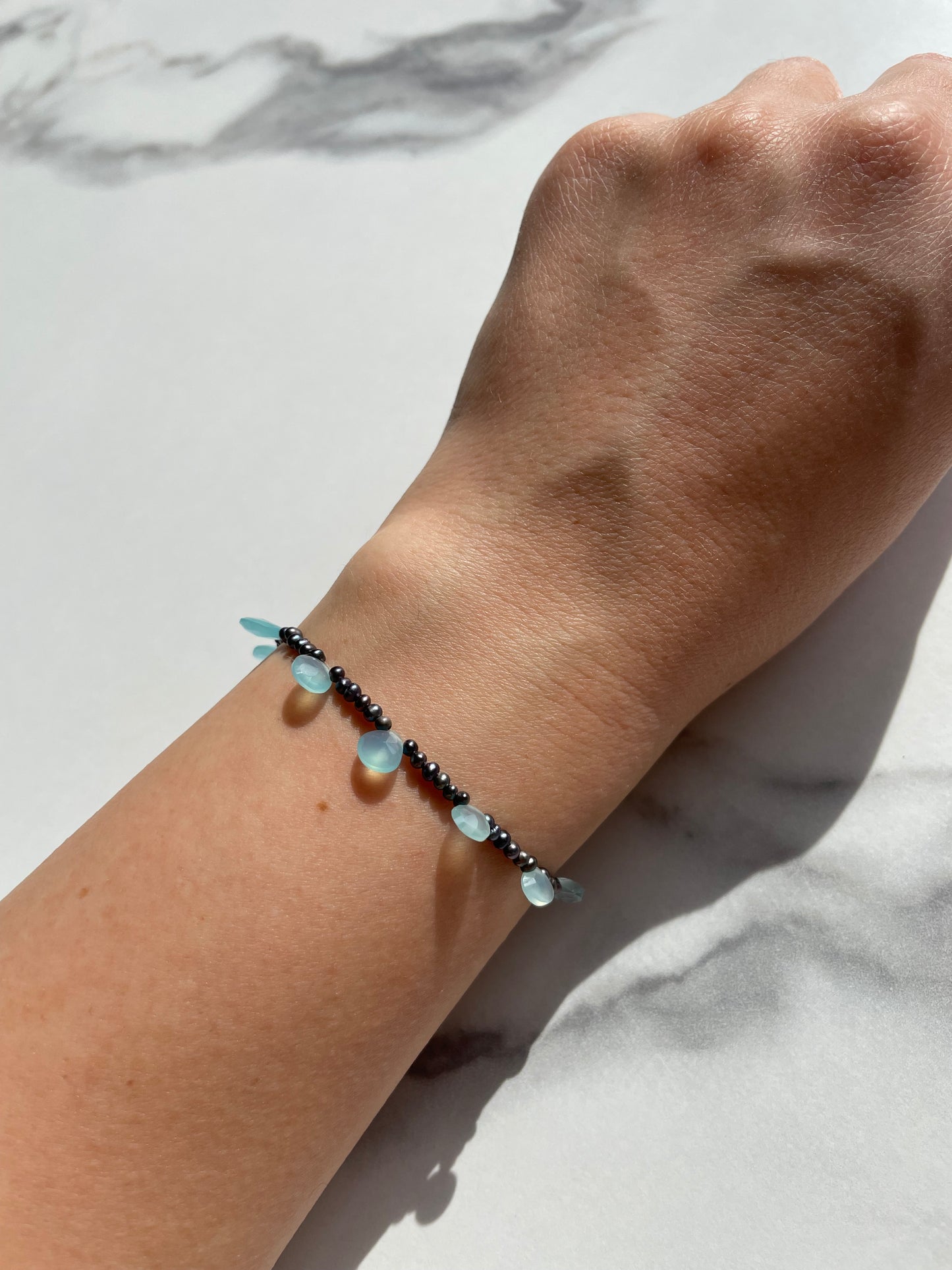 Ocean eyes bracelet / peacock pearls