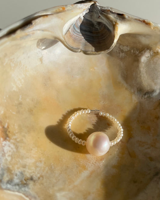 The Ocean Halo ring on tiny pearls